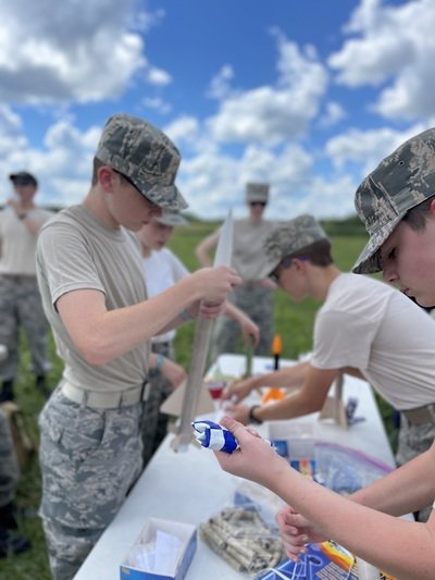 Members of Civil Air Patrol working on an educational project together